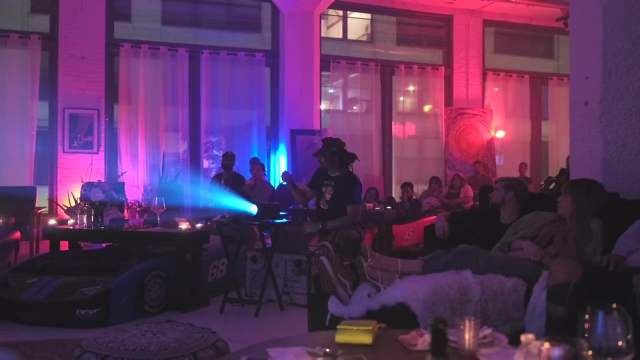 Chicago, 2022: the projector beam over the car beds with the lights down